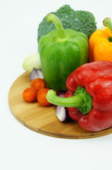 colorful peppers with cherry tomatoes, broccoli and onion over w