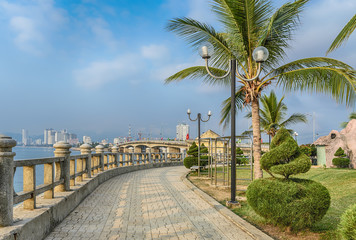 Fototapeta na wymiar Vietnam, Nha Trang. The embankment with the topiary bushes in the shape of a spiral. 