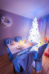 Beautiful Christmas table setting with Christmas tree