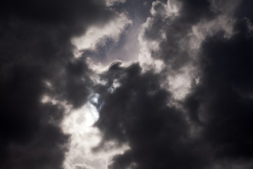 black thundercloud with sunbeam