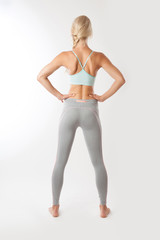 Fototapeta premium Sport fitness woman on the isolated over white background.