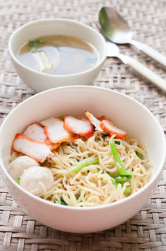 Noodles Soup with Fish Balls on wood table