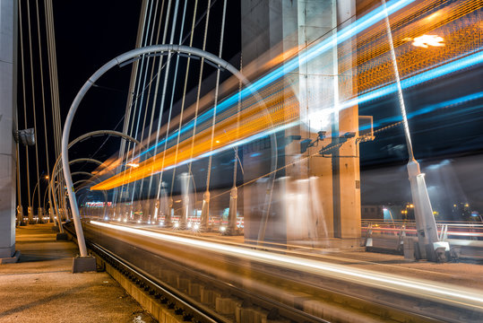 Tram in motion blur on a suspended bridge