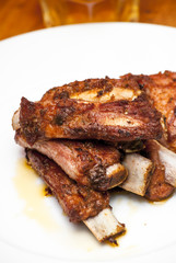 Roasted pork ribs on a white plate
