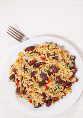 Rice with red beans and vegetables on plate