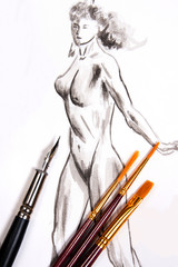 Naklejka premium Ink pen and different kinds of brush with original drawing on ba