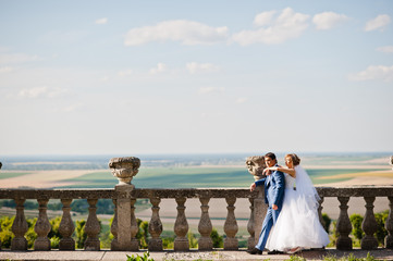 Tender wedding couple background old architecture of castle
