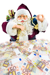 Model of Santa Claus with gifts and euro money