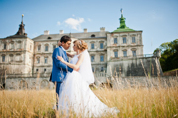 Tender wedding couple background old architecture of castle