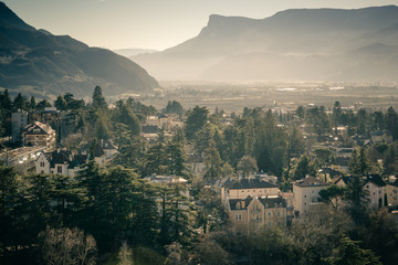 Evening panorama of the city of Merano in vintage style-2. South Tyrol. Italy