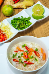 rice gruel in bowl on wooden