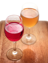 Glass of red and white wine on a white background