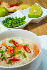 rice gruel in bowl on wooden