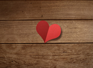 
Paper heart shape on wood table
