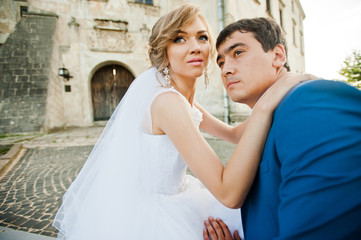 Tender wedding couple background old architecture of castle