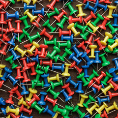 bright colorful push pins background