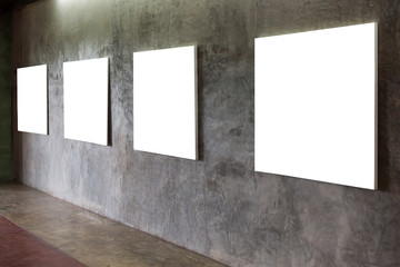 white blank frame on a concrete wall