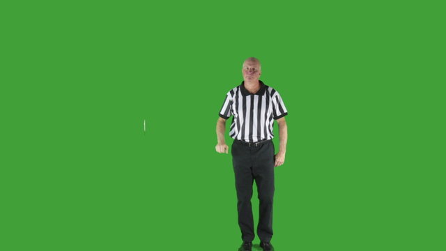 Man dressed in basketball referee uniform signaling Charging.
