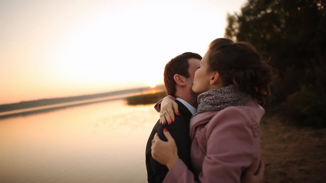 romantic lovers with sunset