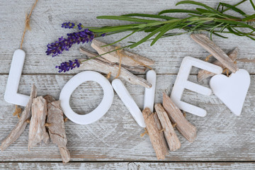 Purple blue Lavender flowers and love letters on a old white wooden shelves background with empty copy space