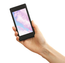 Hand holding mobile smart phone with sky in screen. Cloud computing concept