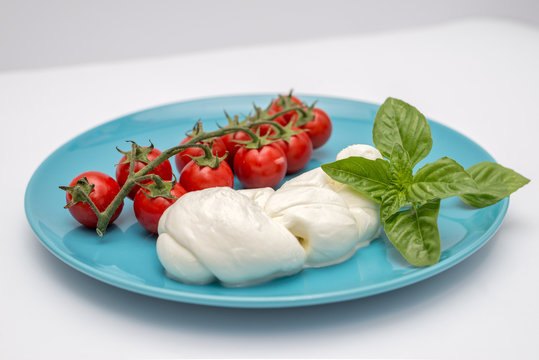 Ingredients for caprese, mozzarella tomato and basil, Italian dish