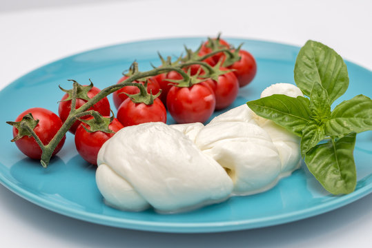 Ingredients for caprese, mozzarella tomato and basil, Italian dish