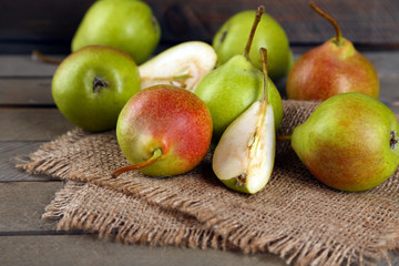 Ripe tasty pears on table close up
