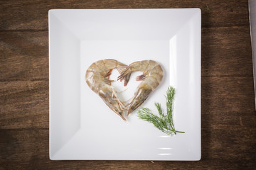 fresh shrimp isolated on  white plate on wooden