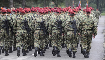 Soldiers marching with rifles