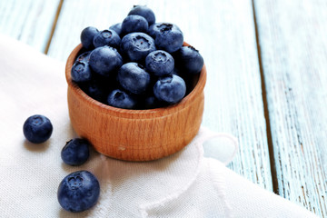 Fresh blueberries in bowl on table close up