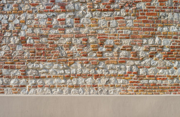 Vintage irregular red brick and limestones wall