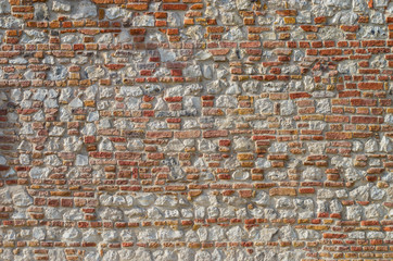 Vintage irregular red brick and limestones wall