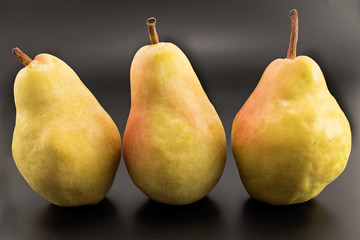 Three pears isolated on the black