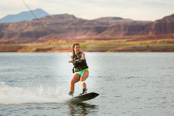 Girl Wakeboarding in Desert Sunshine