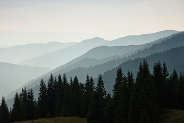 Fototapeta na wymiar Layers of mountain and haze in the valleys.