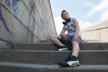 Teenager listening to music on headphones