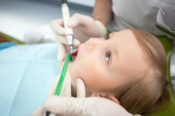 Fototapeta premium Cheerful male child is visiting dental doctor