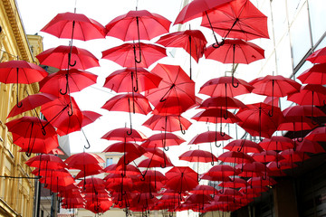 Street decorated with red umbrellas