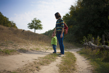 Mother walks with the child.