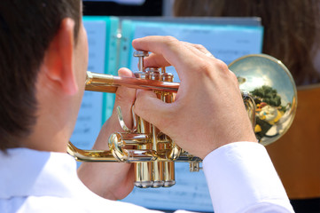 Musician playing on gold trumpet in street orchestra © kirvinic