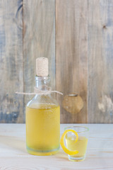 Homemade limonchello on the wooden background