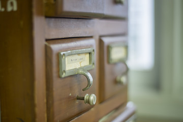 database concept. vintage cabinet. library card or file catalog.