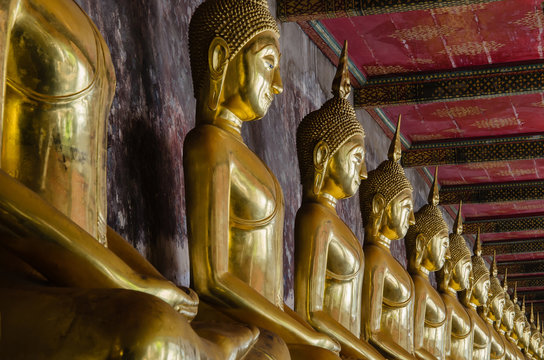 Veranda of Gild Buddha Sculptures at Wat Suthat, Bangkok of Thailand.