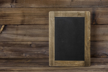Chalkboard on wooden texture. Rustic vintage background