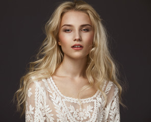Obraz premium Studio portrait of a beautiful young blond woman