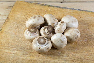 Fresh champignons on a cutting board
