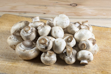 Fresh champignons on a cutting board