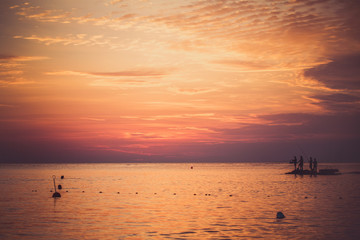 Sea fishing at sunset.