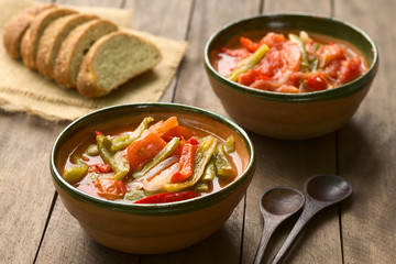 Hungarian traditional dish called Lecso, a vegetarian stew made of onion, pepper and tomato (Selective Focus, Focus in middle of first dish)